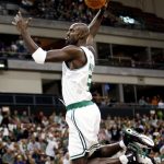 
              FILE - Boston Celtics' Kevin Garnett soars to dunk the ball during the during the first half of a preseason basketball game against the Houston Rockets in Manchester, N.H., Saturday, Oct. 11, 2008. KG is set to add another chapter to his legacy when he becomes the 24th member of the Celtics organization to have his jersey number retired. (AP Photo/Winslow Townson, File)
            