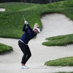 
              Nanna Koerstz Madsen, of Denmark, hits out of the bunker on the first hole during the third round of the JTBC LPGA golf tournament, Saturday, March 26, 2022, in Carlsbad, Calif. (AP Photo/Denis Poroy)
            