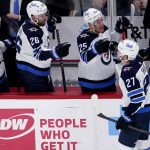 
              Winnipeg Jets left wing Nikolaj Ehlers (27) celebrates with teammates after scored a goal during the first period of an NHL hockey game against the Chicago Blackhawks in Chicago, Sunday, March 20, 2022. (AP Photo/Nam Y. Huh)
            