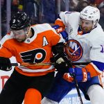 
              Philadelphia Flyers' Ivan Provorov, left, and New York Islanders' Zach Parise battle for position during the third period of an NHL hockey game, Sunday, March 20, 2022, in Philadelphia. (AP Photo/Matt Slocum)
            