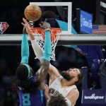 
              New Orleans Pelicans center Jonas Valanciunas (17) attempts to block the shot of Charlotte Hornets center Montrezl Harrell (8) during the first half of an NBA basketball game on Monday, March 21, 2022, in Charlotte, N.C. (AP Photo/Rusty Jones)
            