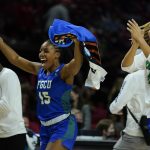 
              Florida Gulf Coast guard Tyra Cox (15) and teammates celebrate after defeating Virginia Tech during a college basketball game in the first round of the NCAA tournament, Friday, March 18, 2022, in College Park, Md. Florida Gulf Coast won 84-81. (AP Photo/Julio Cortez)
            
