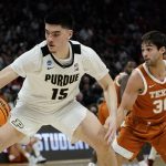 
              Purdue's Zach Edey gets past Texas's Brock Cunningham during the first half of a second-round NCAA college basketball tournament game Sunday, March 20, 2022, in Milwaukee. (AP Photo/Morry Gash)
            