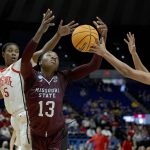 
              Missouri State forward Ifunanya Nwachukwu (13), battles for a rebound against Ohio State forward Tanaya Beacham (35), left, and Oguard Taylor Thierry (14), right, in the first half of a women's college basketball game in the first round of the NCAA tournament, Saturday, March 19, 2022, in Baton Rouge, La. (AP Photo/Matthew Hinton)
            