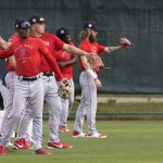 
              Boston Red Sox players warm up during baseball spring training at Jet Blue Park Wednesday March 16, 2022, in Fort Myers, Fla. (AP Photo/Steve Helber)
            