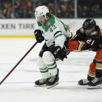 
              Dallas Stars left wing Marian Studenic (43) is pushed by Anaheim Ducks center Isac Lundestrom (21) during the first period of an NHL hockey game in Anaheim, Calif., Thursday, March 31, 2022. (AP Photo/Ashley Landis)
            