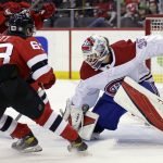 
              Montreal Canadiens goaltender Sam Montembeault (35) makes a save against New Jersey Devils left wing Jesper Bratt (63) during the first period of an NHL hockey game Sunday, March 27, 2022, in Newark, N.J. (AP Photo/Adam Hunger)
            