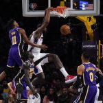 
              Philadelphia 76ers center DeAndre Jordan, center, dunks against Los Angeles Lakers guard Malik Monk (11) during the first half of an NBA basketball game in Los Angeles, Wednesday, March 23, 2022. (AP Photo/Ashley Landis)
            