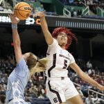 
              South Carolina forward Victaria Saxton (5) blocks a shot by North Carolina guard Alyssa Ustby during the first half of a college basketball game in the Sweet 16 round of the NCAA tournament in in Greensboro, N.C., Friday, March 25, 2022. (AP Photo/Gerry Broome)
            