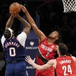 
              Portland Trail Blazers forward Trendon Watford (2) blocks a shot by Brooklyn Nets center Andre Drummond (0) in the first half of an NBA basketball game, Friday, March 18, 2022, in New York. (AP Photo/John Minchillo)
            