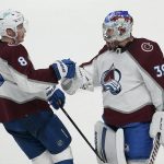 
              Colorado Avalanche defenseman Cale Makar (8) celebrates with goaltender Pavel Francouz (39) after the Avalanche defeated the San Jose Sharks in an NHL hockey game in San Jose, Calif., Friday, March 18, 2022. (AP Photo/Jeff Chiu)
            