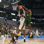 
              Baylor forward Flo Thamba (0) and Norfolk State forward Kris Bankston (30) go up for the rebound during the first half of a college basketball game in the first round of the NCAA tournament in Fort Worth, Texas, Thursday, March 17, 2022. (AP Photo/LM Otero)
            
