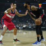 
              Washington Wizards forward Kyle Kuzma (33) defends against LA Clippers forward Marcus Morris Sr. (8) during the first half of an NBA basketball game in Los Angeles, Wednesday, March 9, 2022. (AP Photo/Ashley Landis)
            