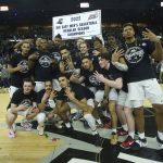 
              Providence celebrates winning the Big East regular season championship after defeating Creighton in an NCAA college basketball game Saturday, Feb. 26, 2022, in Providence, R.I. (AP Photo/Stew Milne)
            