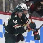 
              Newly acquired Minnesota Wild player Nicolas Deslauriers, left, and Vegas Golden Knights' Braden Pachal chase the puck along the boards in the first period of an NHL hockey game, Monday, March 21, 2022, in St. Paul, Minn. (AP Photo/Jim Mone)
            