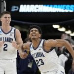
              Villanova forward Jermaine Samuels celebrates after scoring with guard Collin Gillespie during the second half of a college basketball game against Michigan in the Sweet 16 round of the NCAA tournament on Thursday, March 24, 2022, in San Antonio. (AP Photo/David J. Phillip)
            
