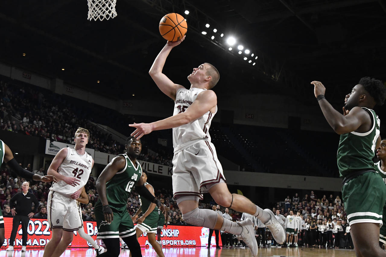 Bellarmine guard CJ Fleming (25) goes up for a layup during the second half of an NCAA college bask...