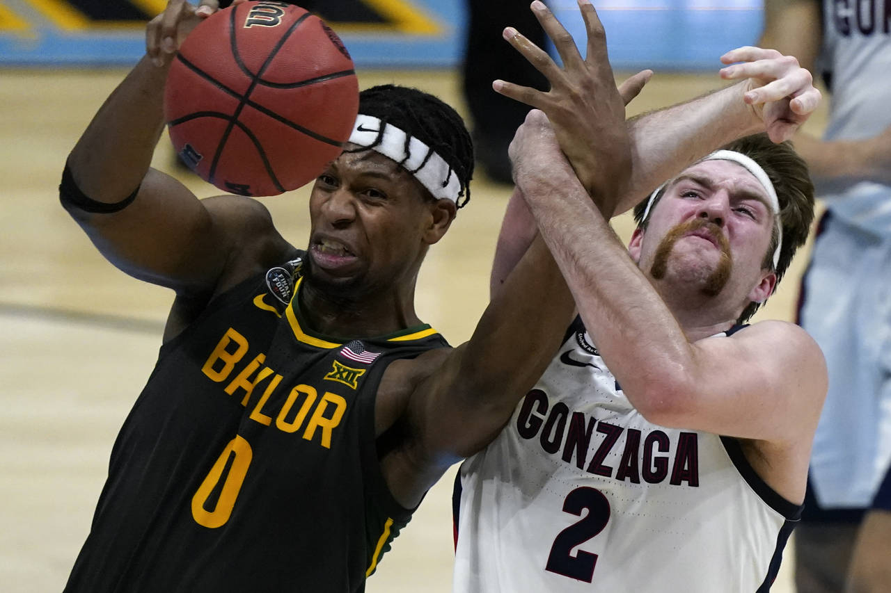 FILE -Baylor forward Flo Thamba (0) fights for a rebound with Gonzaga forward Drew Timme (2) during...