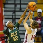 
              Charlotte guard Mikayla Boykin (12) blocks the shot of Indiana guard Ali Patberg (14) in the first half of a college basketball game in the first round of the NCAA tournament in Bloomington, Ind., Saturday, March 19, 2022. (AP Photo/Michael Conroy)
            