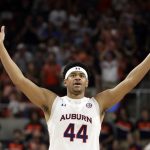 
              Auburn center Dylan Cardwell (44) reacts after a score against South Carolina during the first half of an NCAA college basketball game Saturday, March 5, 2022, in Auburn, Ala. (AP Photo/Butch Dill)
            