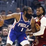 
              Philadelphia 76ers' James Harden (1) works against Cleveland Cavaliers' Darius Garland during the first half of an NBA basketball game Wednesday, March 16, 2022, in Cleveland. (AP Photo/Ron Schwane)
            