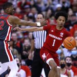 
              Nebraska guard Alonzo Verge, right, chases a loose ball in front of Ohio State guard Malaki Branham during the second half of an NCAA college basketball game in Columbus, Ohio, Tuesday, March 1, 2022. Nebraska won 78-70. (AP Photo/Paul Vernon)
            