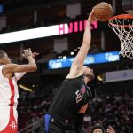 
              Los Angeles Clippers center Ivica Zubac, right, dunks as Houston Rockets guard Jalen Green defends during the second half of an NBA basketball game, Sunday, Feb. 27, 2022, in Houston. (AP Photo/Eric Christian Smith)
            