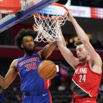 
              Portland Trail Blazers forward Drew Eubanks (24) dunks on Detroit Pistons forward Marvin Bagley III (35) in the second half of an NBA basketball game in Detroit, Monday, March 21, 2022. (AP Photo/Paul Sancya)
            