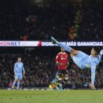 
              Manchester City's Joao Cancelo performs a bicycle kick during the English Premier League soccer match between Manchester City and Manchester United, at the Etihad stadium in Manchester, England, Sunday, March 6, 2022. (AP Photo/Jon Super)
            