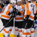 
              Philadelphia Flyers congratulate right wing Cam Atkinson (89) on his goal during the second period of the team's NHL hockey game against the Florida Panthers, Thursday, March 10, 2022, in Sunrise, Fla. (AP Photo/Marta Lavandier)
            