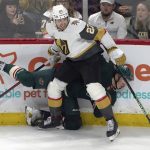 
              Vegas Golden Knights' Shea Theodore (27) checks Minnesota Wild's Matt Boldy into the boards in the second period of an NHL hockey game, Monday, March 21, 2022, in St. Paul, Minn. (AP Photo/Jim Mone)
            