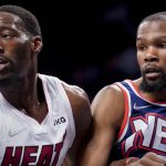 
              Brooklyn Nets forward Kevin Durant, right, and Miami Heat center Bam Adebayo, left, vie for a rebound in the first half of an NBA basketball game, Thursday, March 3, 2022, in New York. (AP Photo/John Minchillo)
            