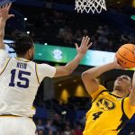 
              Missouri guard Javon Pickett (4) takes a shot over LSU center Efton Reid (15) during the second half of an NCAA men's college basketball game at the Southeastern Conference tournament in Tampa, Fla., Thursday, March 10, 2022. (AP Photo/Chris O'Meara)
            