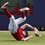 
              Washington Nationals right fielder Andrew Stevenson dives for but can't get to a ball hit by St. Louis Cardinals' Yadier Molina for a single in the first inning of a spring training baseball game, Wednesday, March 30, 2022, in West Palm Beach, Fla. (AP Photo/Sue Ogrocki)
            