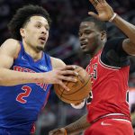
              Detroit Pistons guard Cade Cunningham (2) drives as Chicago Bulls forward Javonte Green defends during the first half of an NBA basketball game, Wednesday, March 9, 2022, in Detroit. (AP Photo/Carlos Osorio)
            