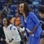
              Kentucky head coach Kyra Elzy yells to her players in the first half of an NCAA college basketball game against LSU at the women's Southeastern Conference tournament Friday, March 4, 2022, in Nashville, Tenn. (AP Photo/Mark Humphrey)
            
