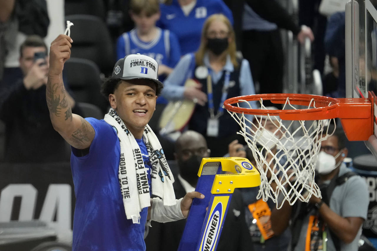 Duke forward Paolo Banchero celebrates after Duke defeated Arkansas in a college basketball game in...