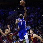 
              Philadelphia 76ers' James Harden (1) goes up for a shot against Cleveland Cavaliers' Cedi Osman (16), Isaac Okoro (35) and Jarrett Allen (31) during the second half of an NBA basketball game, Friday, March 4, 2022, in Philadelphia. (AP Photo/Matt Slocum)
            