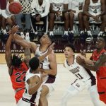 
              Mississippi State forward Garrison Brooks (10) attempts to block a layup attempt by Auburn guard Allen Flanigan (22) during the first half of an NCAA college basketball game in Starkville, Miss., Wednesday, March. 2, 2022. (AP Photo/Rogelio V. Solis)
            
