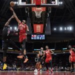 
              Houston Rockets' Christian Wood (35) reaches to block the shot of Los Angeles Clippers' Reggie Jackson (1) during the first half of an NBA basketball game Tuesday, March 1, 2022, in Houston. (AP Photo/David J. Phillip)
            