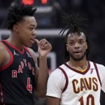 
              Toronto Raptors forward Scottie Barnes (4) talks with Cleveland Cavaliers guard Tim Frazier (10) during the first half of an NBA basketball game Thursday, March 24, 2022, in Toronto. (Nathan Denette/The Canadian Press via AP)
            