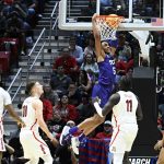 
              TCU forward Chuck O'Bannon Jr. (5) dunks against Arizona during the first half of a second-round NCAA college basketball tournament game, Sunday, March 20, 2022, in San Diego. (AP Photo/Denis Poroy)
            