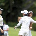 
              Jin Young Ko of South Korea, center, is congratulated by Jeongeun Lee, right, of South Korea and In Gee Chun of South Korea after winning the Women's World Championship golf tournament at Sentosa Golf Club in Singapore, Sunday, March 6, 2022. (AP Photo/Paul Miller)
            