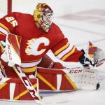 
              Calgary Flames goalie Jacob Markstrom makes a save against the Tampa Bay Lightning during the second period of an NHL hockey game Thursday, March 10, 2022, in Calgary, Alberta. (Larry MacDougal/The Canadian Press via AP)
            