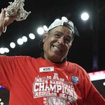 
              Houston head coach Kelvin Sampson celebrates cutting the net after Houston became American Athletic Conference regular season champions after an NCAA college basketball game against Temple, Thursday, March 3, 2022, in Houston. (AP Photo/Justin Rex)
            