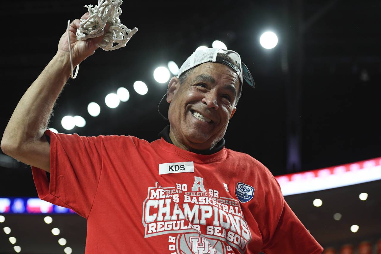 Houston head coach Kelvin Sampson celebrates cutting the net after Houston became American Athletic...