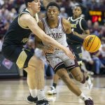
              Texas A&M's Wade Taylor IV drives to the basket against Wake Forest's Jake LaRavia during the first half of an NCAA college basketball game in the third round of the NIT in College Station, Texas, Wednesday, March 23, 2022. (Michael Miller/College Station Eagle via AP)
            