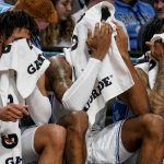 
              The North Carolina starting lineup sits on the bench in the final minutes of the second half of an NCAA college basketball game against Virginia Tech during semifinals of the Atlantic Coast Conference men's tournament, Saturday, March 12, 2022, in New York. (AP Photo/John Minchillo)
            