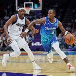 
              Charlotte Hornets guard Terry Rozier (3) dribbles around Dallas Mavericks guard Frank Ntilikina (21) during the first half of an NBA basketball game Saturday, March 19, 2022, in Charlotte, N.C. (AP Photo/Rusty Jones)
            