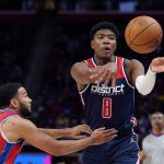 
              Washington Wizards forward Rui Hachimura (8) passes as Detroit Pistons guard Cory Joseph defends during the second half of an NBA basketball game, Friday, March 25, 2022, in Detroit. (AP Photo/Carlos Osorio)
            